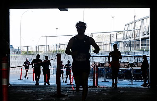 JOHN WOODS / WINNIPEG FREE PRESS
Runners enter the stadium and finish area in the 45th Manitoba Marathon in Winnipeg, Sunday, June 18, 2023. 

Reporter: Donald