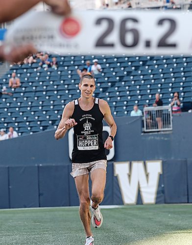 JOHN WOODS / WINNIPEG FREE PRESS
Roger Hopper crosses the line to finish first in the 45th Manitoba Marathon in Winnipeg, Sunday, June 18, 2023. 

Reporter: Donald