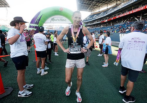 JOHN WOODS / WINNIPEG FREE PRESS
Roger Hopper crosses the line to finish first in the 45th Manitoba Marathon in Winnipeg, Sunday, June 18, 2023. 

Reporter: Donald