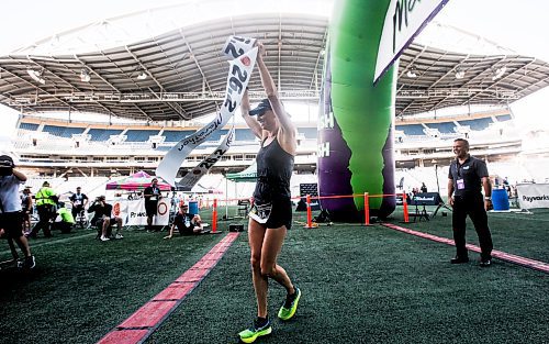 JOHN WOODS / WINNIPEG FREE PRESS
Dawn Neal celebrates winning the 45th Manitoba Marathon in Winnipeg, Sunday, June 18, 2023. 

Reporter: Donald