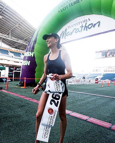 JOHN WOODS / WINNIPEG FREE PRESS
Dawn Neal celebrates winning the 45th Manitoba Marathon in Winnipeg, Sunday, June 18, 2023. 

Reporter: Donald