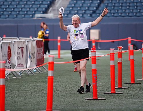 JOHN WOODS / WINNIPEG FREE PRESS
Mark Poppel dances as he finishes his run at the 45th Manitoba Marathon in Winnipeg, Sunday, June 18, 2023. 

Reporter: Donald