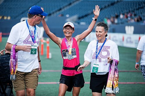 JOHN WOODS / WINNIPEG FREE PRESS
Mingdi Zhao celebrates finishing the 45th Manitoba Marathon in Winnipeg, Sunday, June 18, 2023. 

Reporter: Donald