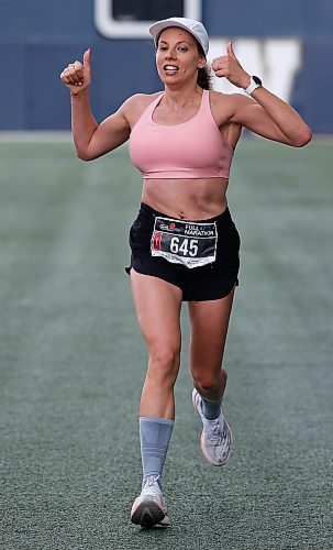 JOHN WOODS / WINNIPEG FREE PRESS
Jessica Wylychenko, celebrates her second place finish in the 45th Manitoba Marathon in Winnipeg, Sunday, June 18, 2023. 

Reporter: Donald