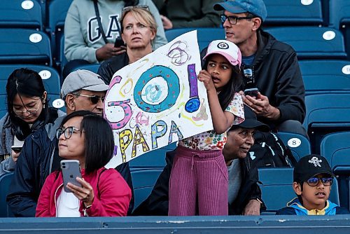 JOHN WOODS / WINNIPEG FREE PRESS
Samaya Bhatt holds up a sign for her dad as he runs his race in the 45th Manitoba Marathon in Winnipeg, Sunday, June 18, 2023. 

Reporter: Donald