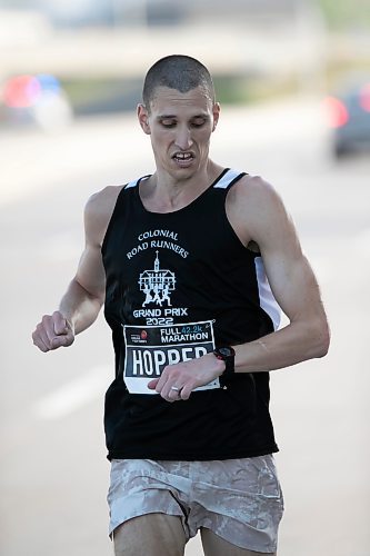 BROOK JONES / WINNIPEG FREE PRESS
Roger Hopper of Chesapeake, Va., checks his watch as he runs down Pembina Highway on his way to winning the men's full marathon, which was the 45th running of the Manitoba Marathon in Winnipeg, Man., Sunday, June 18, 2023.
