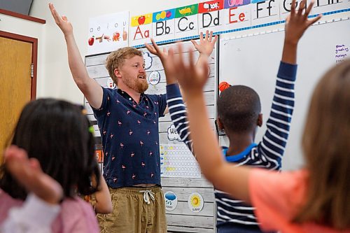 Mike Deal / Winnipeg Free Press
St. George School Kindergarten teacher, Ken Benson, and his students pantomime during a song, Monday, June 12, 2023.
See Maggie Macintosh story
230612 - Monday, June 12, 2023.