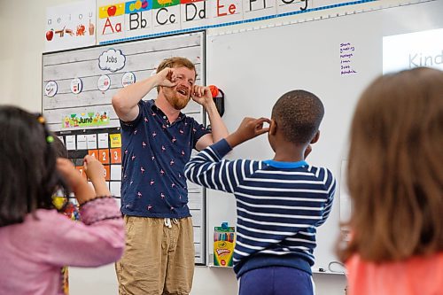 Mike Deal / Winnipeg Free Press
St. George School Kindergarten teacher, Ken Benson, and his students pantomime during a song, Monday, June 12, 2023.
See Maggie Macintosh story
230612 - Monday, June 12, 2023.