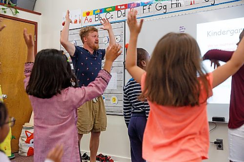 Mike Deal / Winnipeg Free Press
St. George School Kindergarten teacher, Ken Benson, and his students pantomime during a song, Monday, June 12, 2023.
See Maggie Macintosh story
230612 - Monday, June 12, 2023.