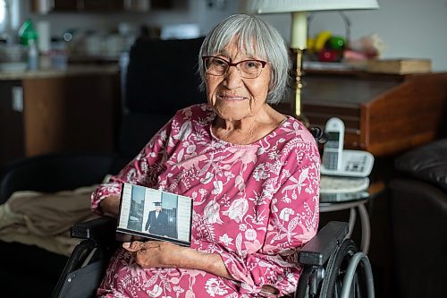 Daniel Crump / Winnipeg Free Press. Eleanor Hunter, of Lake St. Martin First Nation, holds a photo of her grandson Evan Caron from the day he graduate high school. This is her favourite photo of Evan and she says she was so proud of him on that day. June 17, 2023.