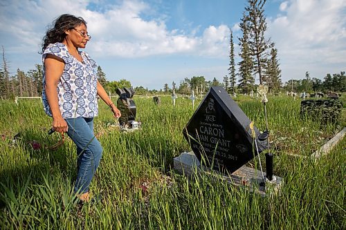 Daniel Crump / Winnipeg Free Press. Vivian Caron visits the grave of her son, Evan Caron, in the Gypsumville cemetery. Evan was shot and killed by police in Winnipeg in 2017. June 17, 2023.