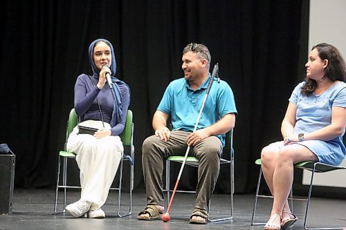 Hadier Elfasay (left) translates for Bahri Sami (right) during a panel for World Refugee Day co-hosted by Brandon University Students' Union and Westman Immigrant Services at the Evans Theatre on Tuesday afternoon. Four former refugees spoke about their experiences of coming to Canada during the panel. (Colin Slark/The Brandon Sun)