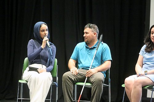 Hadier Elfasay (left) translates for Bahri Sami (centre) during a panel for World Refugee Day co-hosted by Brandon University Students' Union and Westman Immigrant Services at the Evans Theatre on Tuesday afternoon. Four former refugees spoke about their experiences of coming to Canada during the panel. (Colin Slark/The Brandon Sun)