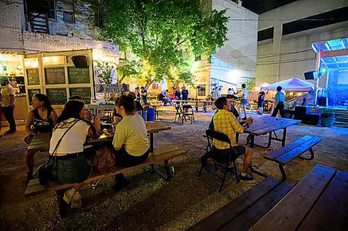Mike Sudoma/Winnipeg Free Press
Patrons at Blue Note Park enjoy conversation over late night drinks Tuesday morning as they wind down from an energetic show from performer Bob Log III 
June 20, 2023