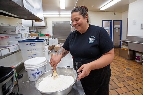 Mike Deal / Winnipeg Free Press
Brandy Bobier founder of Community Helpers Unite (CHU) prepares some bannock in the kitchen at 324 Logan Avenue early Tuesday morning. Community Helpers Unite is an organization that employs around six to eight people who cook and prepare food and distribute them, for free, to various organizations such as Main St Project.
230620 - Tuesday, June 20, 2023.