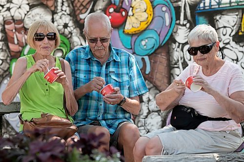 BROOK JONES / WINNIPEG FREE PRESS
Ed Koop and his sisters Ellie Koop (left) and Rina Koop (right) try to beat the heat by enjoying ice cream at the Bridge Drive-In in Winnipeg, Man., Tuesday, June 20, 2023.  Ed, who lives in Abbotsford, B.C., made sure he stopped by the BDI, while in town visiting his sisters.