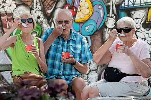 BROOK JONES / WINNIPEG FREE PRESS
Ed Koop and his sisters Ellie Koop (left) and Rina Koop (right) try to beat the heat by enjoying ice cream at the Bridge Drive-In in Winnipeg, Man., Tuesday, June 20, 2023.  Ed, who lives in Abbotsford, B.C., made sure he stopped by the BDI, while in town visiting his sisters.