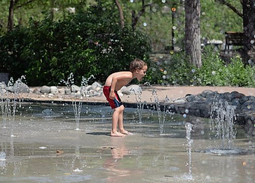 Mike Thiessen / Winnipeg Free Press 
Orion Trudeau beats the heat at the Fort Parka splash pad at The Forks. 230620 &#x2013; Tuesday, June 20, 2023