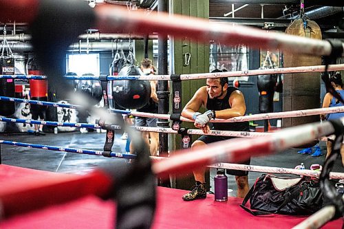 MIKAELA MACKENZIE / WINNIPEG FREE PRESS


Angel De Paz relaxes a he edge ofe ring after class a the Pan Am Boxing Club (downtown&#x573; oldest boxing club) on Tuesday, June 20, 2023.  For Josh 24h story.
Winnipeg Free Press 2023