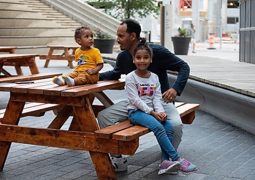 JESSICA LEE / WINNIPEG FREE PRESS

Aron Zerabruk spends time with his son Abinar and daughter Silvana at True North Square June 20, 2023.

Reporter: Katie May
