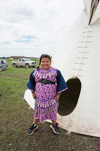 Rosalie Ledoux, age 7, wore a traditional dress to the Rolling River First Nation Pow Wow on Wednesday. (Miranda Leybourne/The Brandon Sun)