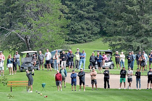 A large gallery looks on as Nolan Ritchie hits a tee shot on the third hole during Tamarack golf tournament men's final at Clear Lake Golf Course last summer. (Thomas Friesen/The Brandon Sun)