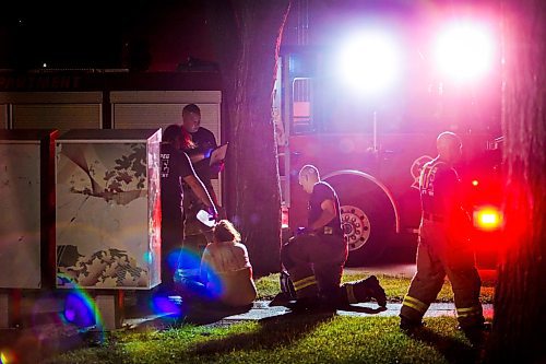 JOHN WOODS / WINNIPEG FREE PRESS
Winnipeg Fire Paramedic Services assist a person who suffered a bear spray attack just off Burrows Tuesday, June 20, 2023. 

Reporter: Lett/24 hr