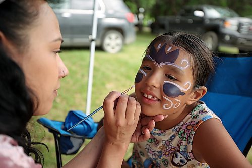 Alexis Waters, 7, has her face painted by Kayla Pratt during Sioux Valley Dakota Nation’s grand reopening of the Grand Valley Campground, which coincided with National Indigenous Peoples Day celebrations on Wednesday. (Photos by Tim Smith/The Brandon Sun)