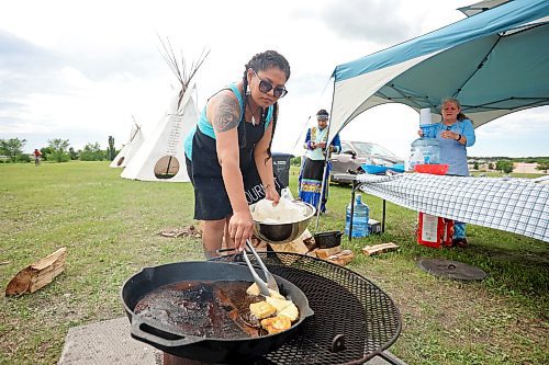 Meghan Hapa of Birdtail Sioux Dakota Nation and Sioux Valley Dakota Nation cooks fry bread during National Indigenous Peoples Day celebrations at the Riverbank Discovery Centre on Wednesday. 
(Tim Smith/The Brandon Sun)