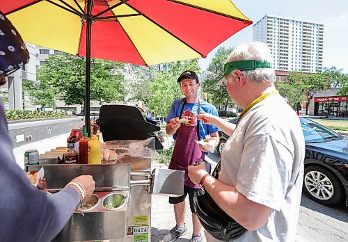 RUTH BONNEVILLE / WINNIPEG FREE PRESS

24 hour project - Broadway Hotdog cart

Justin Kalinski has a hot dog cart, Mister K's Hot Dogs, always in front of WCB building on Broadway.  He started working with his grandpa as a preteen, then he took it over years later, putting himself through Business School at University of Manitoba with his earnings. 

Longtime, daily customer, Markus Buchart, a lawyer working in the area, buys a hot dog from Justin Tuesday.

See Dean Pritchard's story. 

June 20th, 2023
