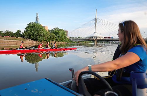 RUTH BONNEVILLE / WINNIPEG FREE PRESS

24 hour project - Rowing club 

Members of the Winnipeg Rowing Club, Leah Miller (white, gold), Becca Zubricki, Kate Nazar and Justine Gillert (front of boat to back), along with other members in single boats, train in the early morning hours on the Red River with Winnipeg's skyline in the background Tuesday. Coach, Janine Stephens, coaches from a motor boat  nearby.  

June 20th, 2023
