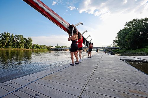 RUTH BONNEVILLE / WINNIPEG FREE PRESS

24 hour project - Rowing club 

Members of the Winnipeg Rowing Club, Leah Miller (white, gold), Becca Zubricki, Kate Nazar and Justine Gillert (front of boat to back), along with other members in single boats, train in the early morning hours on the Red River with Winnipeg's skyline in the background Tuesday. Coach, Janine Stephens, coaches from a motor boat  nearby.  

June 20th, 2023
