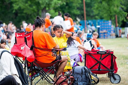 MIKAELA MACKENZIE / WINNIPEG FREE PRESS


Helen George helps her granddaughter, Minosin Mckay (three), get her jingle dress regalia on for the Pow Wow on National Indigenous Peoples Day at The Forks on Wednesday, June 21, 2023.  For Cierra Bettens story.
Winnipeg Free Press 2023