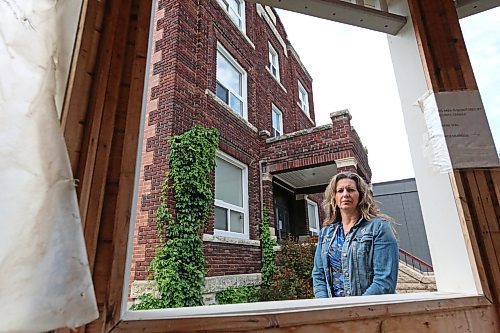 Lois Ruston, executive director of YWCA Brandon, stands outside the organization's Meredith Place transitional housing building at 148 11th Street on Wednesday afternoon. The YWCA Brandon board of directors announced its decision yesterday to decommission and demolish Meredith Place, which has been deemed uninhabitable and closed since May 2022. (Matt Goerzen/The Brandon Sun)