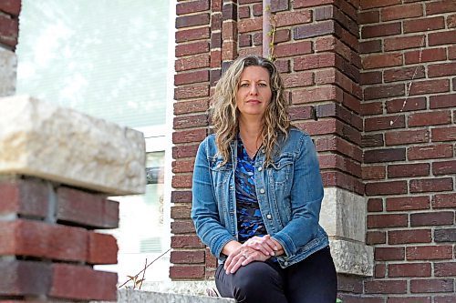 Lois Ruston, executive director of YWCA Brandon, sits at the front steps of the organization's Meredith Place transitional housing building at 148 11th Street. On Wednesday, the YWCA Brandon board of directors announced its decision to decommission and demolish Meredith Place, which has been deemed uninhabitable and closed since May 2022. (Matt Goerzen/The Brandon Sun)