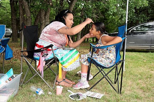 21062023
Seven-year-old Alexis Waters has her face painted by Kayla Pratt during Sioux Valley Dakota Nation&#x2019;s grand re-opening of the Grand Valley Campground and National Indigenous Peoples Day celebrations on Wednesday.
(Tim Smith/The Brandon Sun)