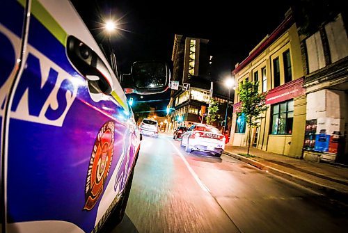 JOHN WOODS / WINNIPEG FREE PRESS
Winnipeg Fire Paramedic Services district chief Steve Brglez pulls up to a police cruiser while cruising downtown Tuesday, June 20, 2023. 

Reporter: Lett/24 hr