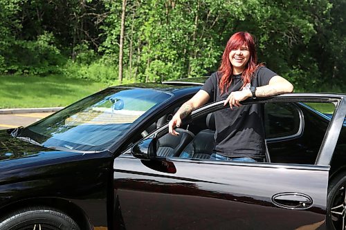 Sam, a 21-year-old Brandonite, poses with her 2002 Chevrolet Monte Carlo Dale Earnhardt edition at a Brandon park on Thursday. (Michele McDougall/The Brandon Sun) 