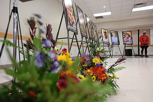 16052023
An RCMP officer stands beside photos of the 16 individuals who died in the June 15, 2023, collision near Carberry, Manitoba during a press conference at Credit Union Place in Dauphin where the names of the sixteen individuals were announced to the media. Family members and first responders were on hand for the press conference.  (Tim Smith/The Brandon Sun)