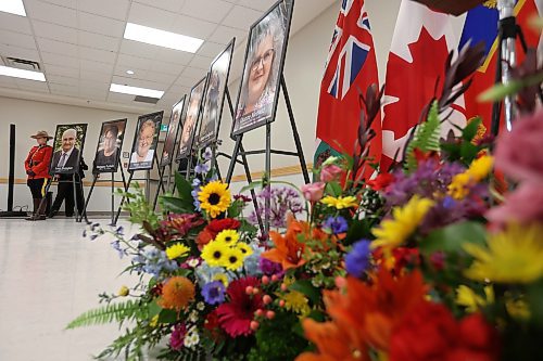 16052023
An RCMP officer stands beside photos of the 16 individuals who died in the June 15, 2023, collision near Carberry, Manitoba during a press conference at Credit Union Place in Dauphin where the names of the sixteen individuals were announced to the media. Family members and first responders were on hand for the press conference.  (Tim Smith/The Brandon Sun)