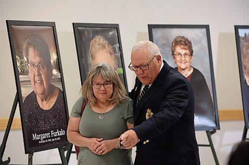 22062023
Family members placed photos of the sixteen individuals who died in the June 15, 2023, collision near Carberry, Manitoba during a press conference at Credit Union Place in Dauphin on Thursday where the names of the sixteen individuals were announced to the media. Family members and first responders were on hand for the press conference.  (Tim Smith/The Brandon Sun)