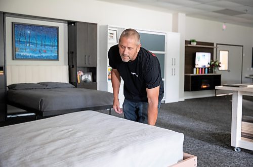 JESSICA LEE / WINNIPEG FREE PRESS

Mike Solumundson demonstrates a Murphy bed at the Wood Products Unlimited showroom June 22, 2023.

Reporter: Martin Cash