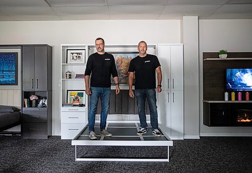 JESSICA LEE / WINNIPEG FREE PRESS

Rob Enns (left) and Mike Solumundson are photographed at the Wood Products Unlimited showroom June 22, 2023 with their Murphy bed.

Reporter: Martin Cash
