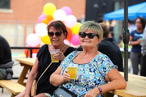 Denise Thomson and Cathy Chicoime enjoy some beverages at Section 6 Brewing during Friday’s Summer Soulstice Block Party, which took place in downtown Brandon. (Kyle Darbyson/The Brandon Sun)