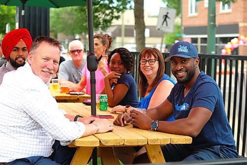 Brandon East MLA Len Isleifson chats with some Westman residents during Friday’s Summer Soulstice Block Party in downtown Brandon. (Kyle Darbyson/The Brandon Sun)