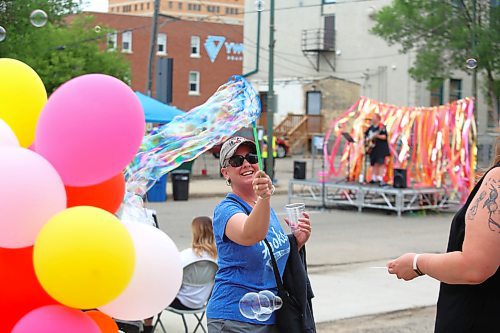 Shauna Beard creates a massive bubble during Friday’s Summer Soulstice Block Party on Princess Avenue. (Kyle Darbyson/The Brandon Sun)