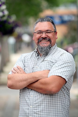 Brandon East Liberal candidate Trenton Zazalak stands along Rosser Avenue on Friday afternoon. (Matt Goerzen/The Brandon Sun)