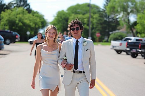 Bree Lyn and Ben Roulette stroll down 2nd Avenue in Rivers during the afternoon portion of Rivers Collegiate’s graduation festivities. The high school’s Class of 2023 consists of 19 graduates. (Kyle Darbyson/The Brandon Sun)