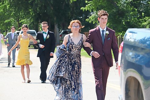 Rivers Collegiate graduates Taylor Bridgeman and Judah Paddock lead Friday’s graduate parade, which took place along 2nd Avenue and concluded at the Riverdale Community Centre. (Kyle Darbyson/The Brandon Sun)