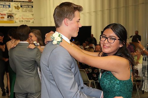 Simon Krahn dances with Payton Demas during the evening portion of Friday’s Rivers Collegiate graduation festivities, which took place in and around the Riverdale Community Centre. (Kyle Darbyson/The Brandon Sun)